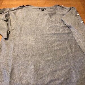Gray lightweight sweater with heart shaped crystal look buttons on the shoulder